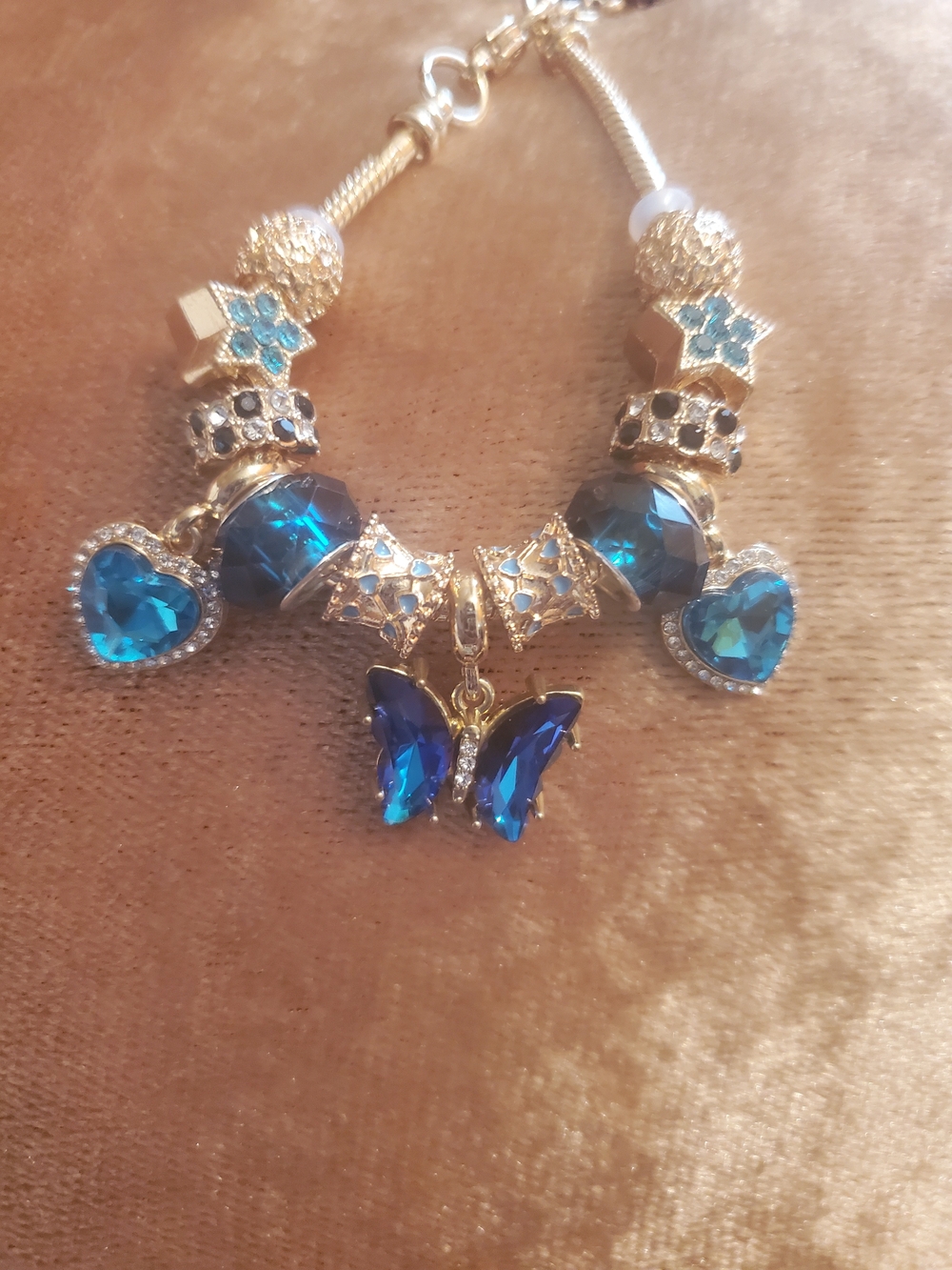 Gold Bracelet with Blue Crystal Hearts & Butterfly Charm